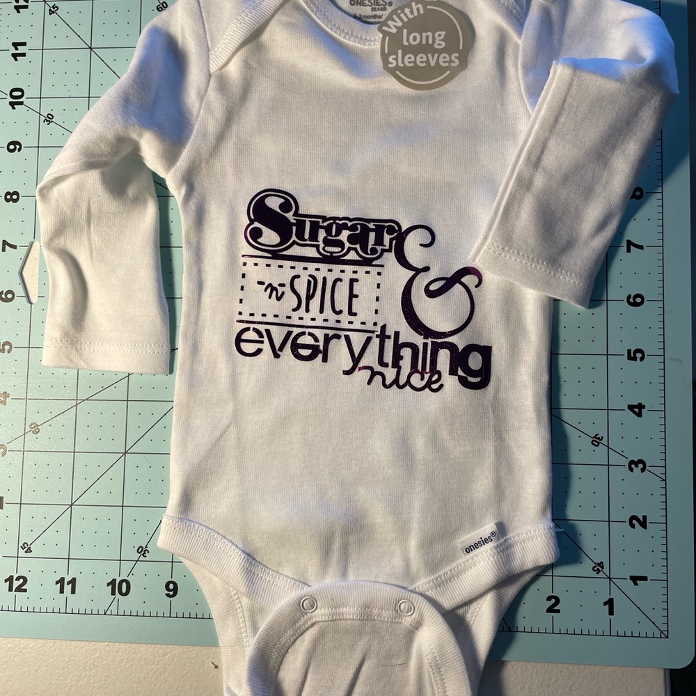 Onesie T for Baby says “Sugar & Spice & Everything nice” in Purple Foil Iron on